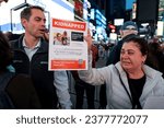Small photo of New York, NY, USA 10.19.2023: A protester holds up a missing poster of Yarden Roman at a rally for the release of Hostages being held by Hamas in Times Square, NYC on October 19th, 2023