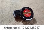 Small photo of black shoe polish and the brush I use to blacken loafers for work
