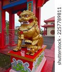 Small photo of Pontianak Indonesia, February 04, 2023, A golden lion statue as a decoration and a symbol of the power to exorcise evil spirits located in a temple in the city of Pontianak