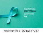 Small photo of the text international stuttering awareness day and an aquamarine awareness ribbon supporting those who stutter, on an aquamarine background
