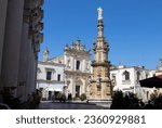 Small photo of NARDO', ITALY, JULY 17, 2022 - View of the church of Saint Tryphon (San Trifone) and the Spire of the Immaculate in the center town of Nardo, province of Lecce, Puglia, Italy