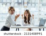 Small photo of Asian business woman celebrating victory, won profitable contract, unexpected amazing win, big deal on stock, impressive achievement, unbelievable success, funny positive emotions at office.