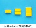 Small photo of Category concept. Different shape of yellow wooden geometry block rearrange into its category.
