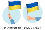 ukraine flag in hand. patriotic ... | Shutterstock . vector #1427347694