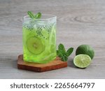 Small photo of Kuwut Ice or es kuwut is balinese drink which is quite famous in bali because of its sweet and slightly sour taste from a mixture of Shredded Melon, Young Coconut, Basil Seed and lime. selected focus