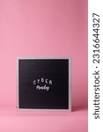Small photo of Cyber monday lettering on letter board isolated on pink background. Cyber monday sale concept.