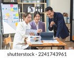 Small photo of Asian business team consists of marketing staff. accountant and financial officer Help each other analyze company profits using tablets. calculator Laptop computers, graph paper, and corporate pens.