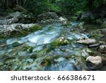 Forest creek with waterfalls. Water cascading over rocks.crystal clear water in mountain river.