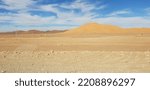 Small photo of white clouds in Blue sky on shara's dune. dry desert in Algeria near Taghit. december 2018