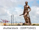 Small photo of COTONOU, BENIN – SEPTEMBER 2022: Amazon Monument, metal structure with a bronze casing, installed in the 12th arrondissement of the city of Cotonou in southern Benin.