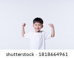 Small photo of Healthy Asian boy about 4 year olds with strong arm gesture