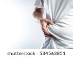Man touching his fat belly on white background