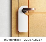 mock up of a hanger label on a wooden door. 3d rendering