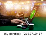 Woman hands with Gambling Chips using laptop for playing online casino. Concept virtual leisure activity.