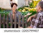 Small photo of neighbors man and woman chatting near the