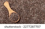 Small photo of Chia seeds close-up with a wooden spoon. Chia seeds macro. Dry healthy supplement for proper nutrition.