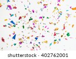 colourful sparlking confetti on white background