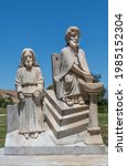 Small photo of Santa Inez, CA, USA - April 3, 2009: San Lorenzo Seminary. Station of the Cross number 1 statue in white marble. Jesus is condemned to death. Under blue sky with green foliage in back.