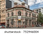 Small photo of Sydney, Australia - March 25, 2017: IFGF Christian Sect headquarters and church on corner of George and Regent street near Railway Station is a historic building. Banner of founder Sun Myung Moon.