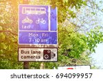 Bus Lane Cameras Road Sign, Bus, Motorcycle, Bicycle, Taxi Mon-Fri 7-10 am. With Sunrise
