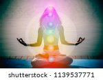 Small photo of Yoga meditation hands woman in yoga lotus pose with seven chakras, aura, spiritual and Yin Yang symbols, balancing your life in nature concept.