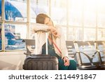 Business woman hopeless waiting for the late train in the station - Traveler sad and unhappy woman at the airport with canceled flight