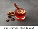 Mulled Wine with Raspberry wine.  cinnamon, dried clove buds. white background. 