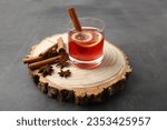 Mulled Wine with Raspberry wine.  cinnamon, dried clove buds. white background. 