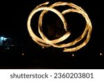 Small photo of Pictures I took of a local man playing with fireballs and giving a foreshow on the beach