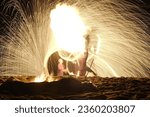 Small photo of Pictures I took of a local man playing with fireballs and giving a foreshow on the beach