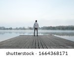 Young Man Standing Alone On...