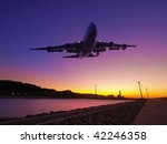 Sunset and airplane fly over river