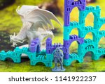Small photo of Krasnodar, Russia - July 25, 2018: Playing board game 'Elven Castle'; dragon, rpg character, elven castle