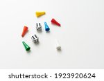 Game cubes, chips, hourglass on a white background. The concept of home Board games, classes at home with children, developmental training, logic games. Flatlay and space for text.