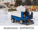 Small photo of Ice resurfacing machine ,Ice resurfacer, resurfacing the ice rink in the central park of the town.