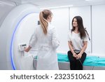 Small photo of Female patient undergoing MRI - Magnetic resonance imaging in Hospital. Medical Equipment and Health Care