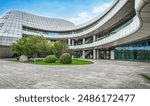 Modern Urban Landscape with Curved Building and Green Courtyard