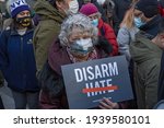 Small photo of NEW YORK, NY - MARCH 19: A woman holds a sign that reads "disarm hate" at a peace vigil to honor victims of attacks on Asians in Union Square Park on March 19, 2021 in New York City.