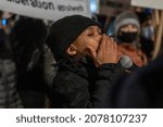 Small photo of NEW YORK, NEW YORK - NOVEMBER 19: People holding signs march in Brooklyn against the acquittal of Kyle Rittenhouse on November 19, 2021 in New York City.