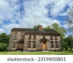 Small photo of Concord, Massachusetts, USA - June 18, 2023: Colonel James Barrett House on Barrett's Mill Road. Built circa 1705. Wooden farmhouse now a part of Minute Man National Historical Park. Front view.
