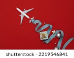 merry christmas travel concept plane model christmas decorations travel by plane travel by air concept christmas celebrations with relatives christmas background in red iconic design decoration enjoy