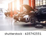 black car repair station with soft-focus in the background and over light