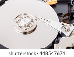Small photo of Close-up view of an opened computer hard disc drive, non-volatile storage device