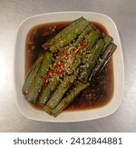Small photo of Purple eggplant is a perennial herbaceous plant that is grown for consumption of its fruit as a vegetable ingredient. By steaming, we can get soft meat and smother it in Hong Kong-style sauce