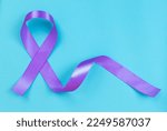 Small photo of Purple ribbon on blue background ADD,ADHD,Alzheimer Disease ,Arnold Chiari Malformation,Childhood Hemiplegia stroke, Epilepsy, Chronic Acute Pain,Crohns