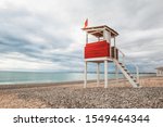 lifeguard tower on the beach against a stormy sea. observation red tower