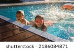 Small photo of Refreshing at heat weather. Cheerful children in googles smiling while playing in swimming pool at sunny day, active vacation and healthy lifestyle, happy summertime, banner format