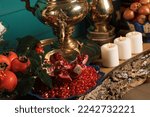 Small photo of Yalda Night is an Iranian festival celebrated on the longest and darkest night of the year on 30th of Azar with persimmon, pomegranate, nuts, candles, autumn tart dessert, and poetry books of Hafez