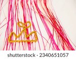 Small photo of merry christmas. happy new year. xmas decoration. winter holiday party tinsel decor. festive background. crowm on pink tinsel.