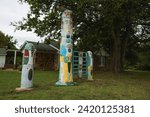 Small photo of Foyil, Oklahoma - September 9, 2020: Totems in front of the old house at Ed Galloway's Totem Pole Park, a 1930's Route 66 attraction.